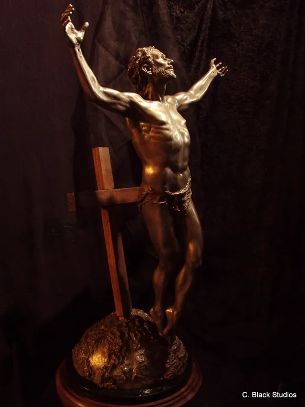 Resurrection, bronze sculpture by Colleen Black, a figure with raised arms before a wooden cross